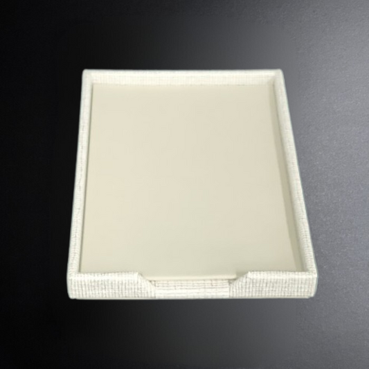 Rectangular white tray on a dark gray background