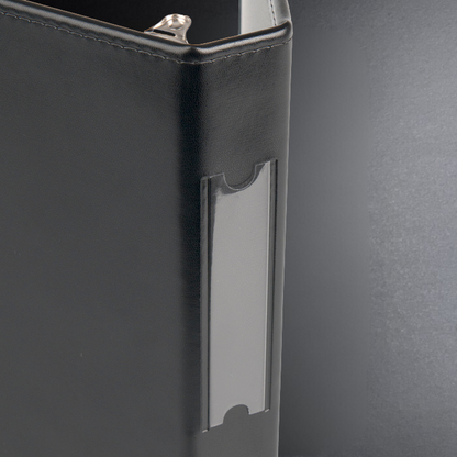 Black leather wallet with a card holder on a gray background