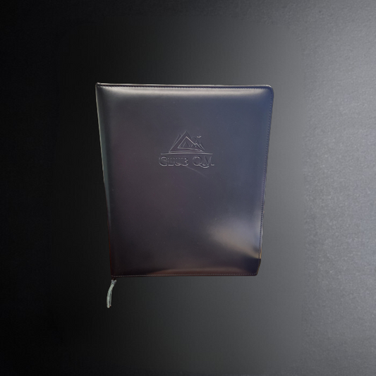 Dark blue notebook with a logo on a black background