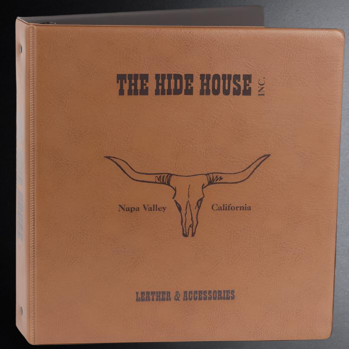 Brown leather-bound book with 'The Hide House' branding and longhorn skull illustration.