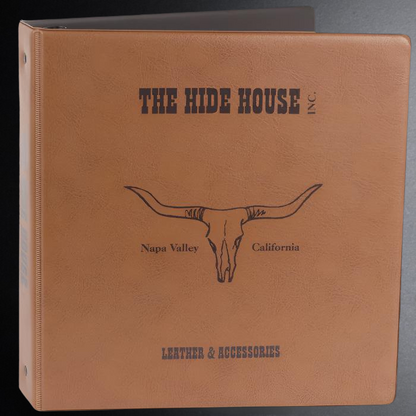 Brown leather-bound book with 'The Hide House' branding and longhorn skull illustration.