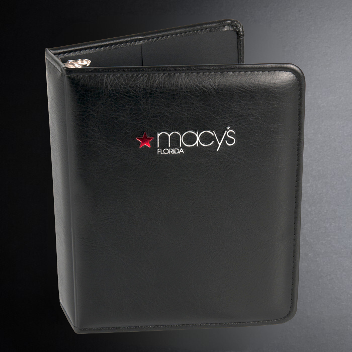 Black leather menu cover with Macy's Florida logo on a dark background