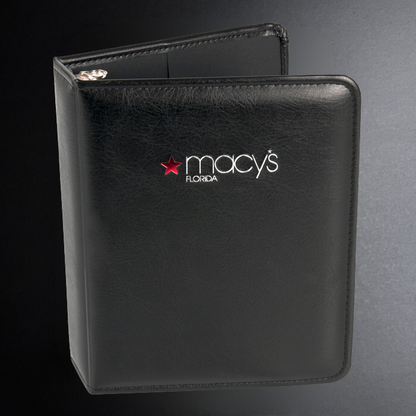 Black leather menu cover with Macy's Florida logo on a dark background