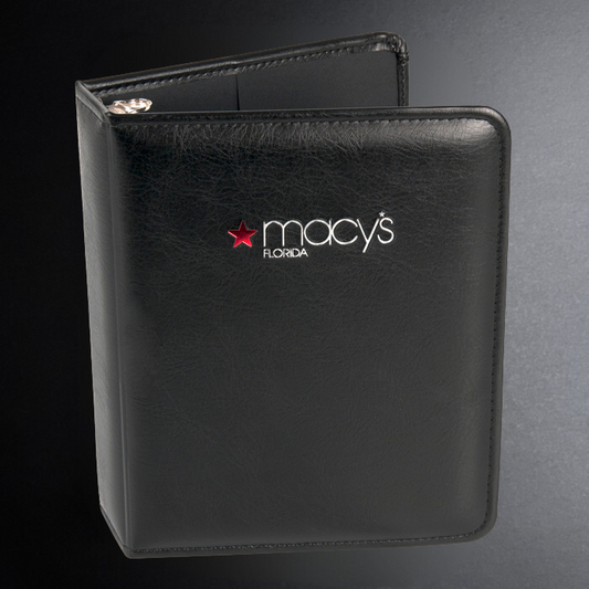 Black leather menu cover with Macy's Florida logo on a dark background