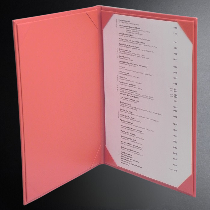 Pink menu cover with a white menu inside on a dark background