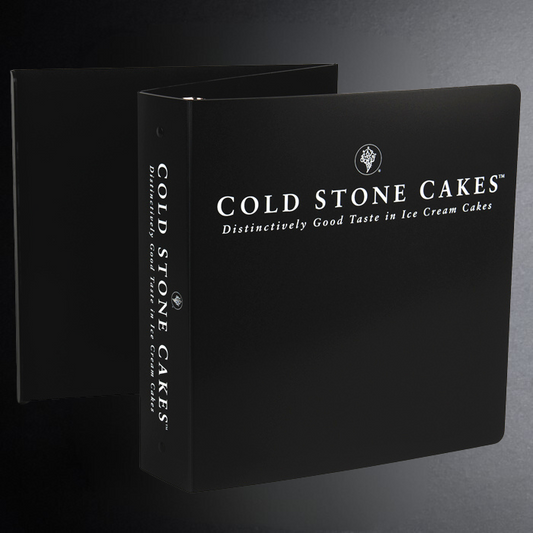 Black packaging with 'Cold Stone Cakes' branding on a gray background
