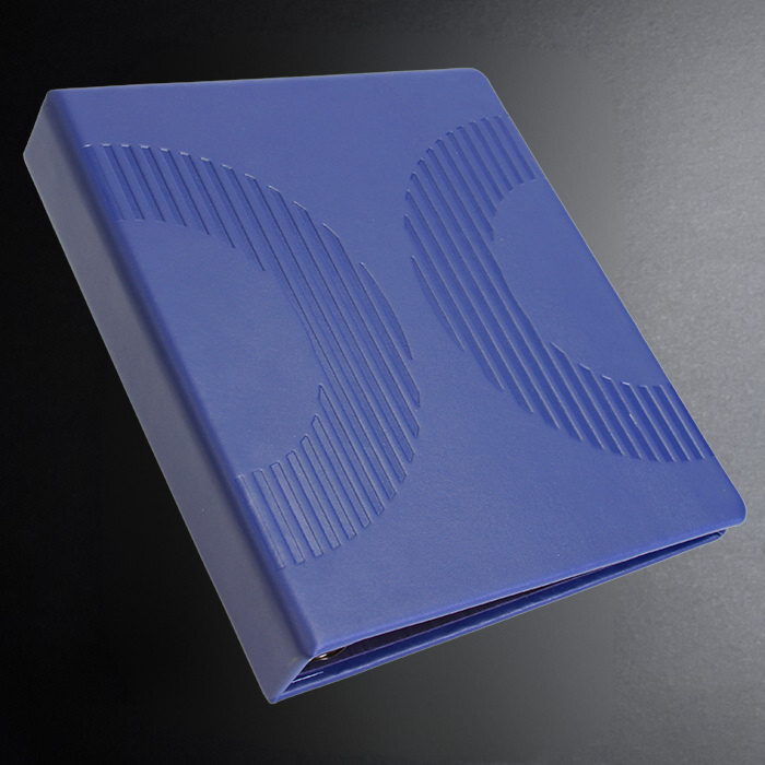 Blue notebook with embossed design on a dark background