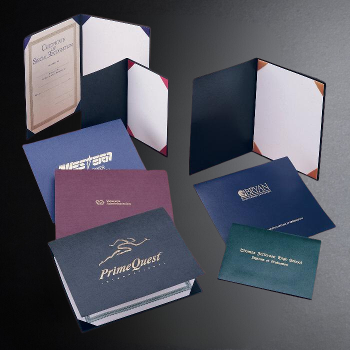 Collection of diploma folders with various designs and branding on a dark background