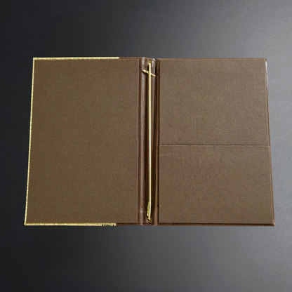 A brown textured binder or folder with a gold-tone metal ring closure, shown open against a dark gray gradient background.