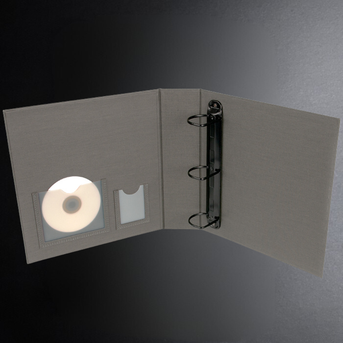 Gray CD case with a CD inside on a dark gray background