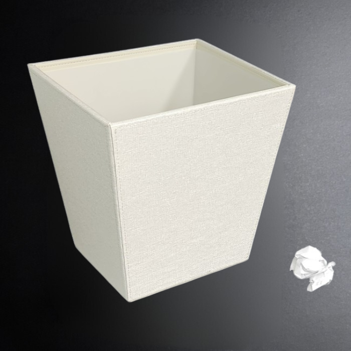 White textured wastebasket on a dark gray background