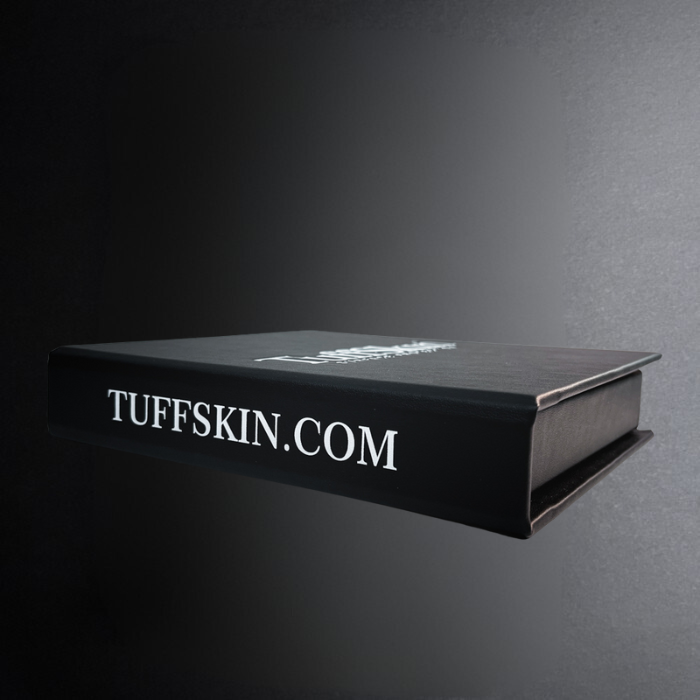 Black book with 'TUFFSKIN.COM' text on a dark background