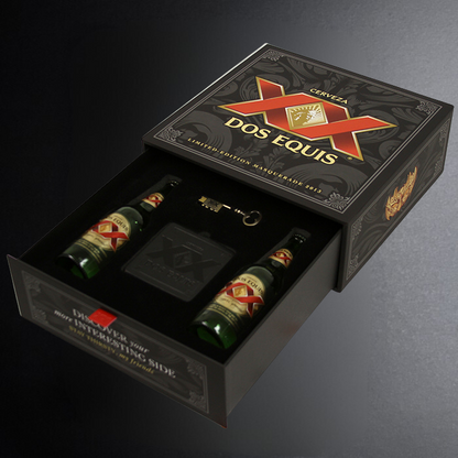 Dos Equis beer gift set with two bottles, a wallet, and a keychain in a decorative box.