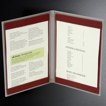 Open menu with drink options on a dark background