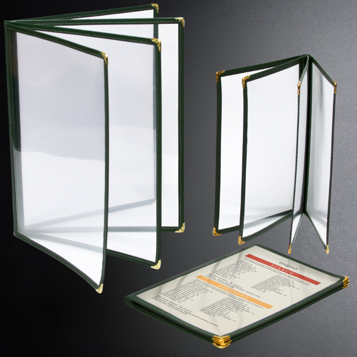 Two green menu covers with gold trim on a dark background