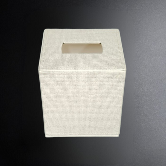 White textured square tissue box on a dark background