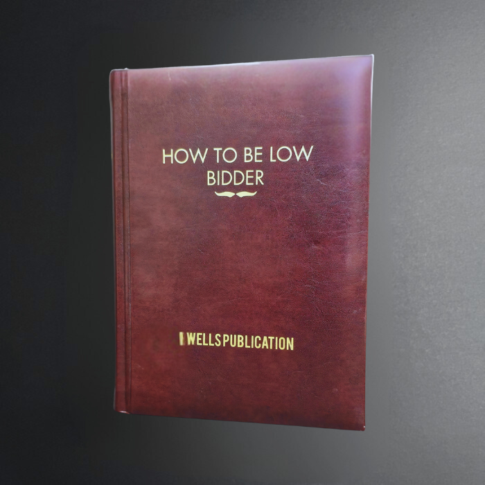 Book titled 'How to Be Low Bidder' by Wells Publiction on a dark background