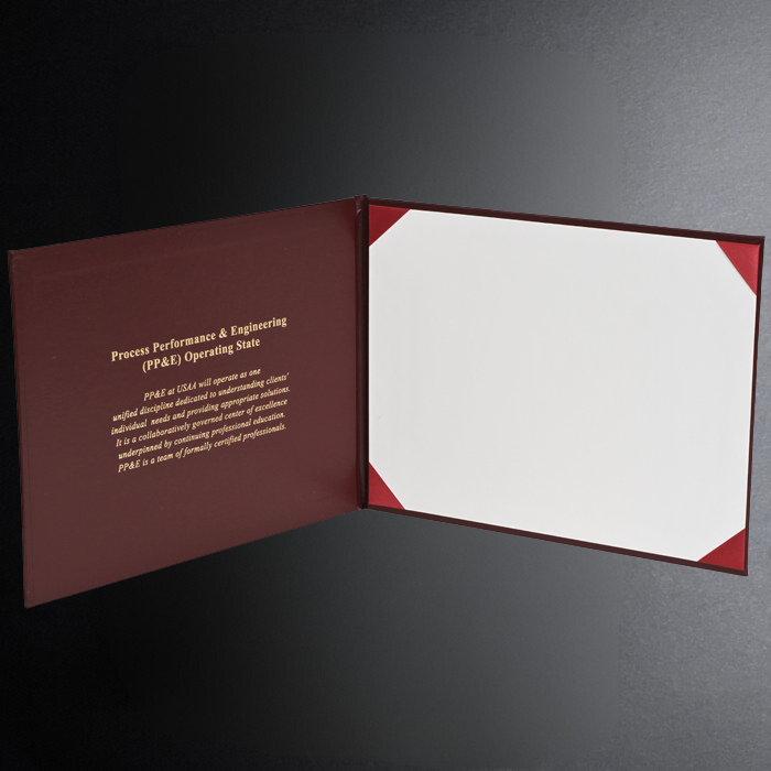 Open maroon folder with white interior on a dark gray background