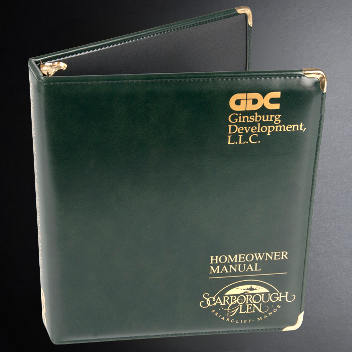 Green binder with 'GDC Ginsburg Development, L.L.C.' and 'Starborough Glen' branding on a black background