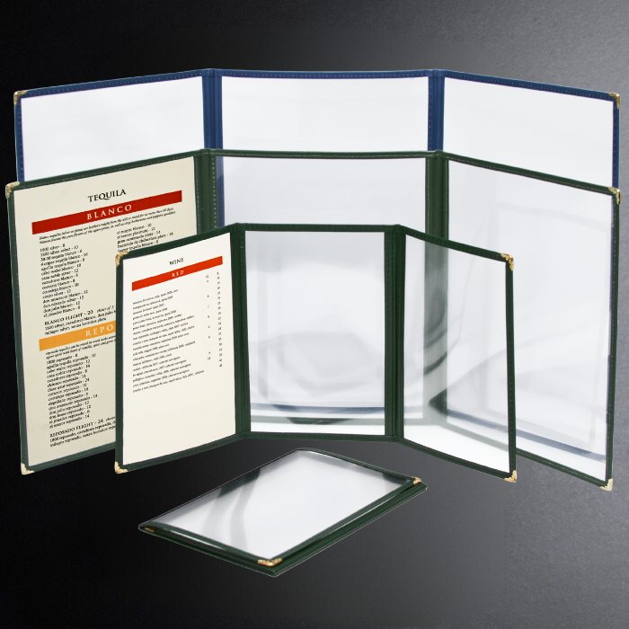 Set of open menu covers with a glass on a dark background