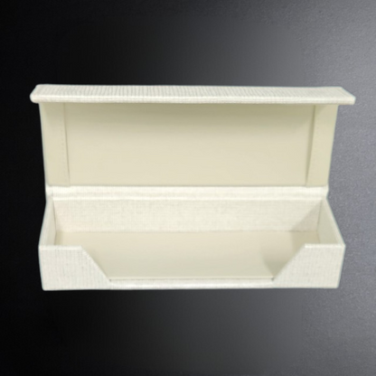 White shoe rack with two shelves on a dark background