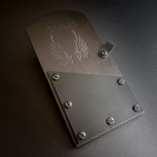 A wood check presenter with a leather cover and rivets, featuring an engraved logo.