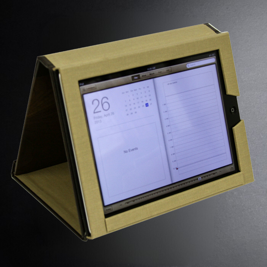 Gold tablet stand with a tablet displaying a calendar app on a dark background