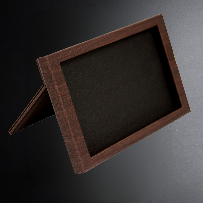 Wooden picture frame on a dark gray background