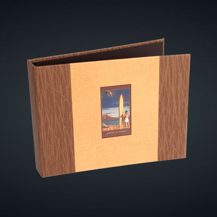 A directory binder with a surfer theme, featuring a wall-covering vinyl cover with a die cut window for a printed/laminated tip-in.