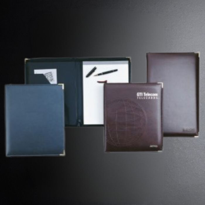 Collection of leather-bound books with GTI Telecom branding on a dark background