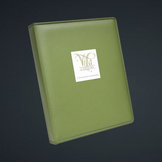 A green directory with a debossed logo on the front, constructed with a faux leather cover and a hard cover hinge.