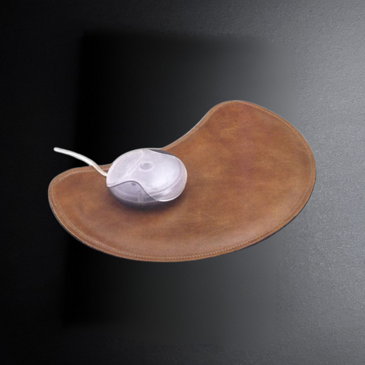 Brown mouse pad with a white computer mouse on a dark background