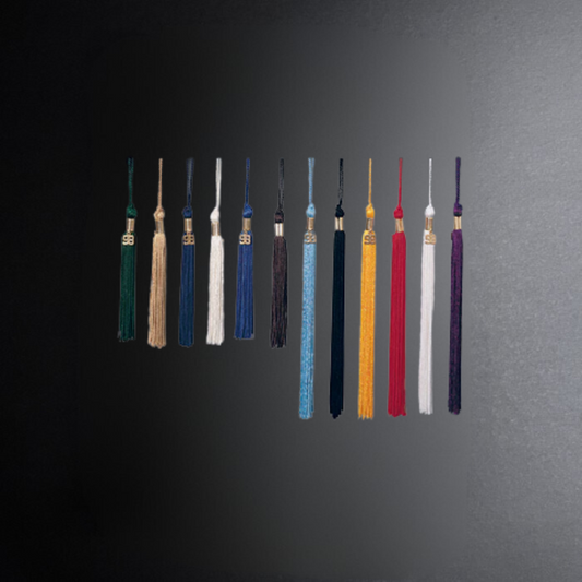 Set of colorful tassels on a dark gray background