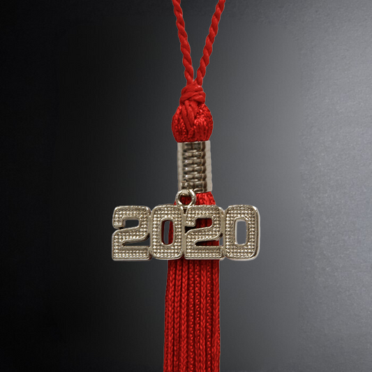 Graduation cap tassel with '2020' charm on a dark background