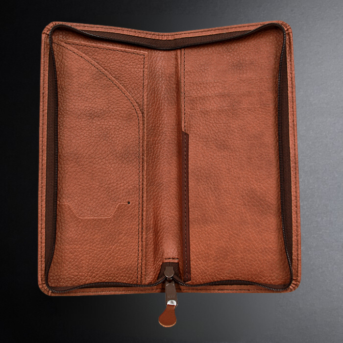 Brown leather wallet on a dark background