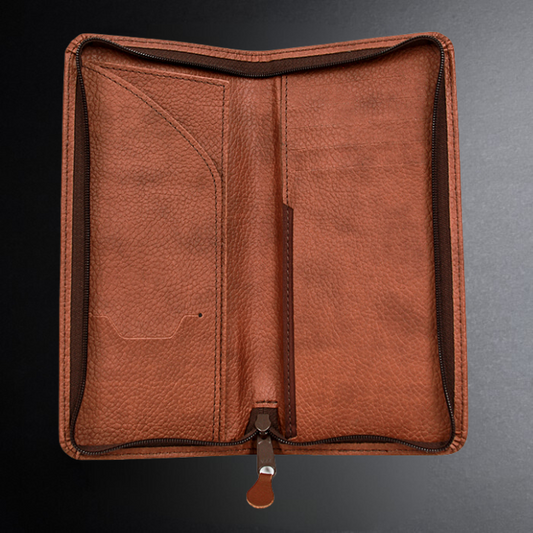 Brown leather wallet on a dark background