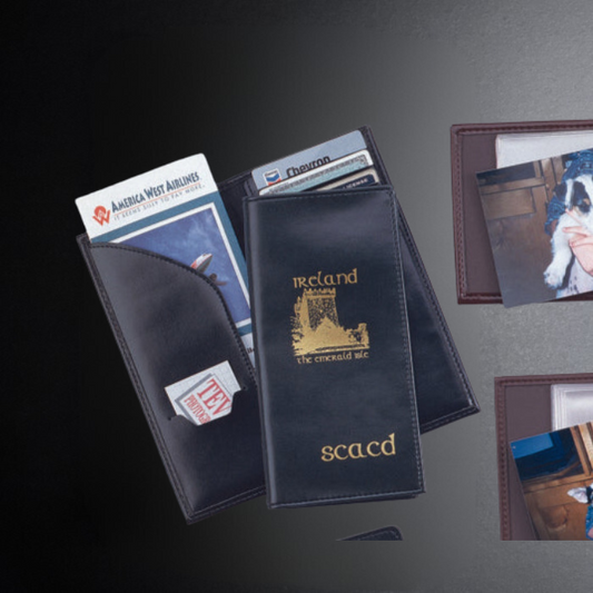 Collection of travel wallets with various cards and a passport on a dark surface