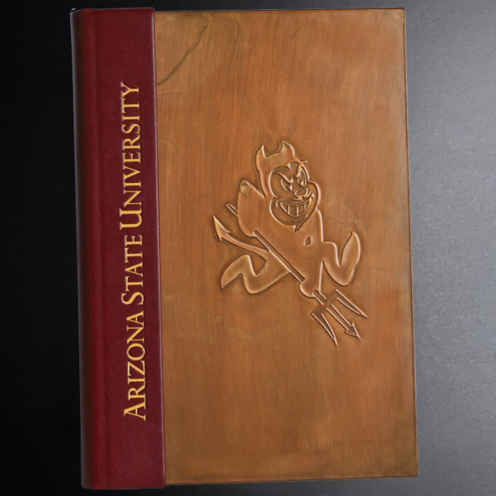 Book with Arizona State University logo on a dark background