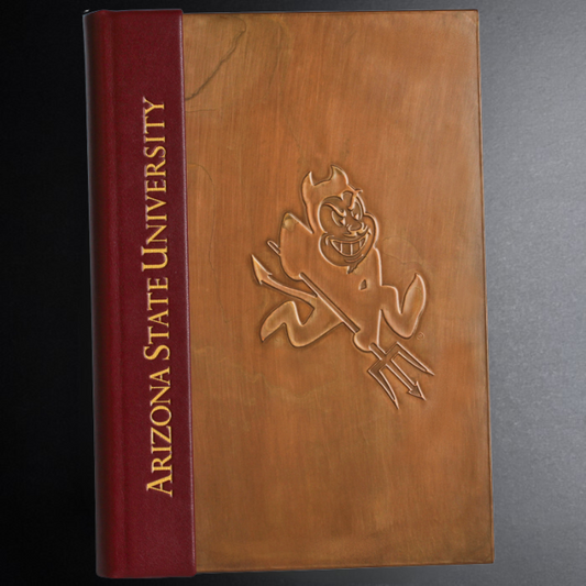 Book with Arizona State University logo on a dark background