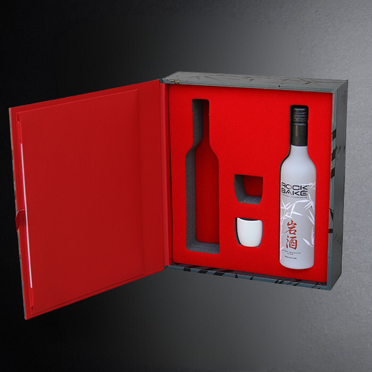 White bottle with black cap in a red box on a gray background