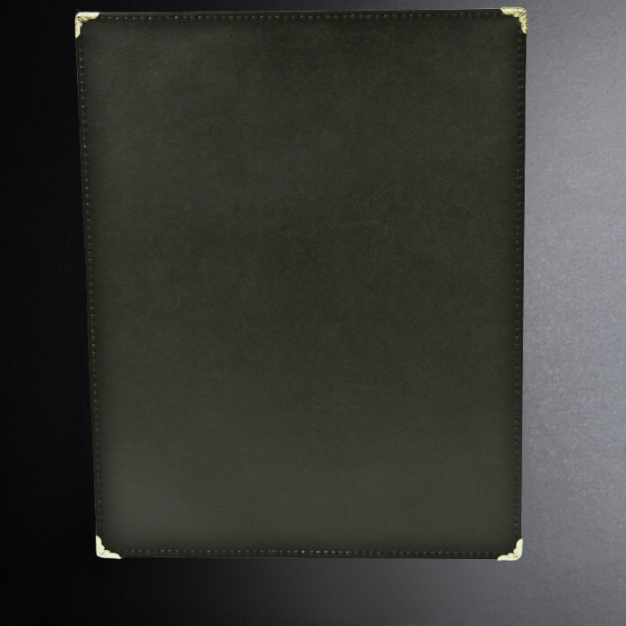 Black leather-bound menu cover on a black background