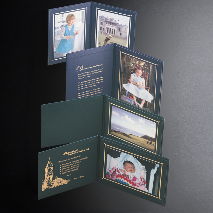 Fold-out photo album with pictures of a child and text on a dark background