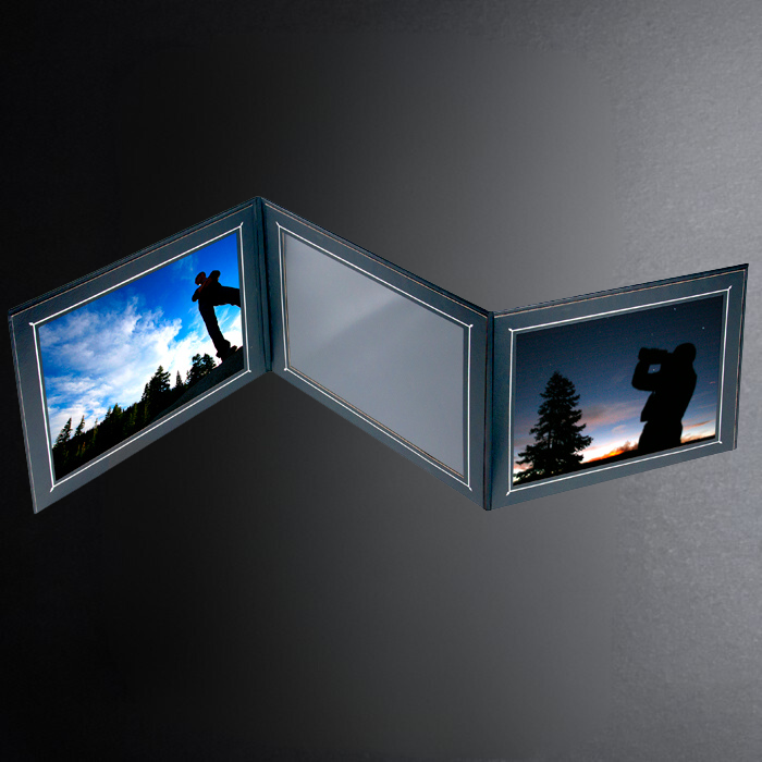 Two framed photographs of a person taking a photo of a sunset with trees on a dark gray background.