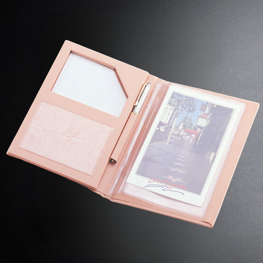 Open pink folder with documents on a dark background