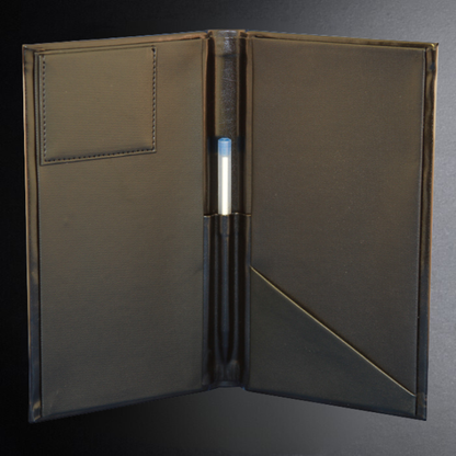 Brown leather menu cover with pen holder on a dark background