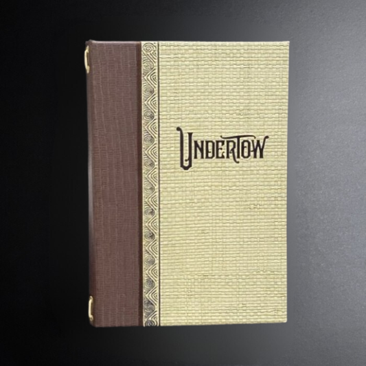 Book with 'Undertow' embossed on the cover against a dark background