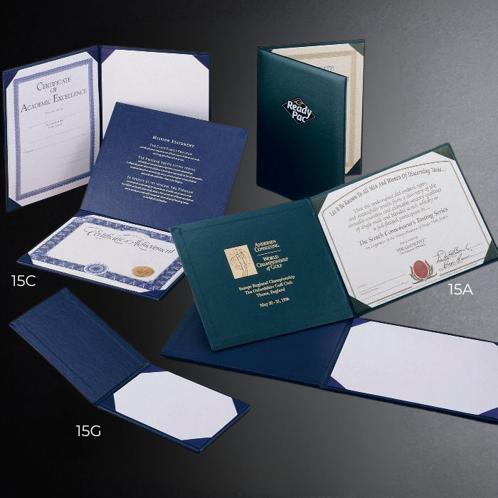 Collection of diploma covers and certificates on a dark background