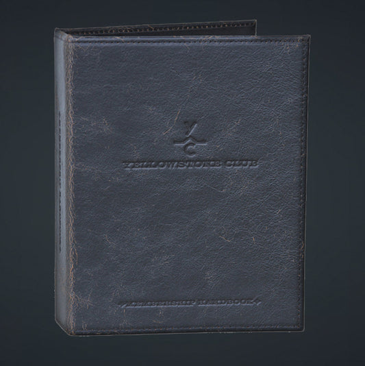 A black leather junior binder with a debossed logo on the cover, featuring a stitched spine and a horizontal pocket.