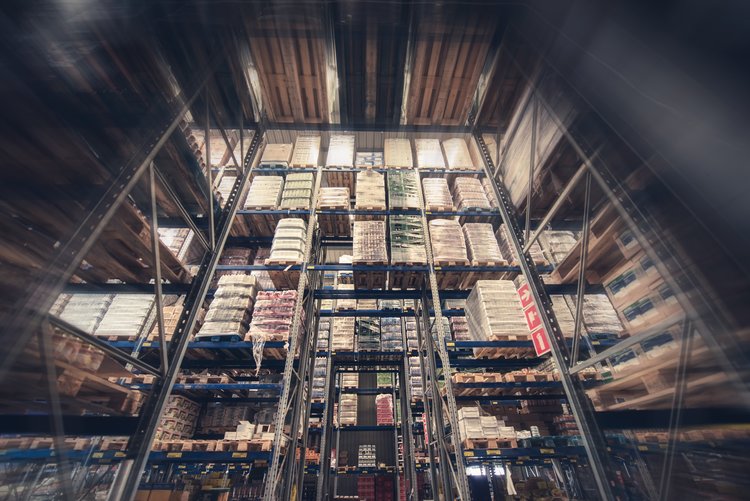 High rack storage system with stacked pallets in a warehouse.